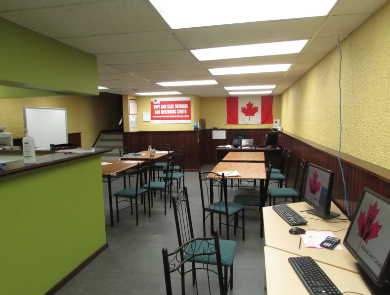 Hope and Care tutoring centre classroom with study tables and computer stations