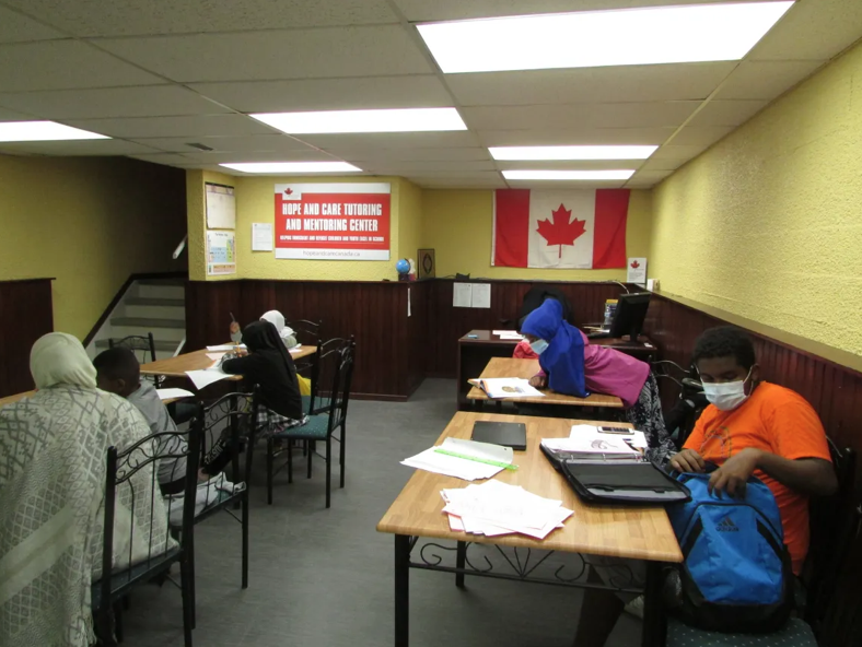Students completing schoolwork at the Hope and Care tutoring centre
